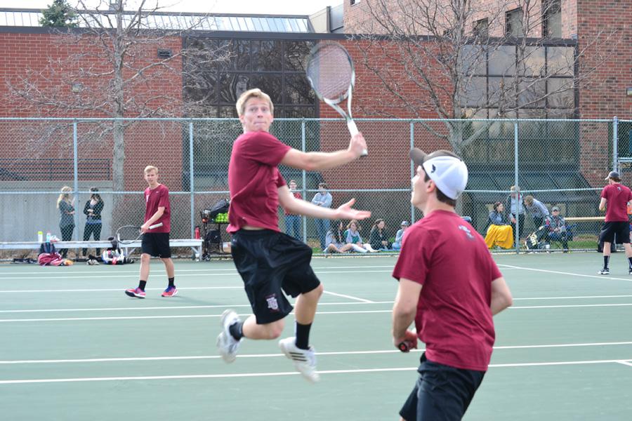 Senior Derek Lutz and first-year Cody Jahrig rally during their match last Friday afternoon, April 25.