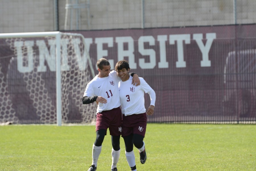 First-year James Reardon (left) celebrates with first-year Francisco Guzman (right) after Guzman scored his first career goal.