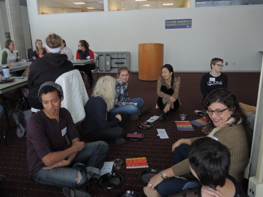 The hunger banquet  randomly divides students into groups that vary in income and socioeconomic status. This group, which represents the lowest income class, sits on the floor. 