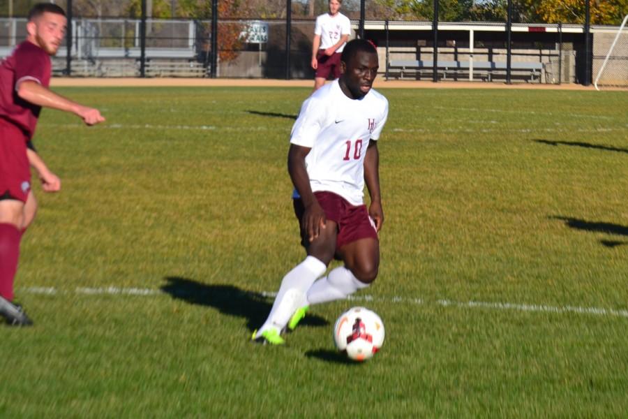 Senior Gilbert Ghong dribbling the ball against the Augsburg Auggies on Oct. 15 at Pat Paterson Fields.