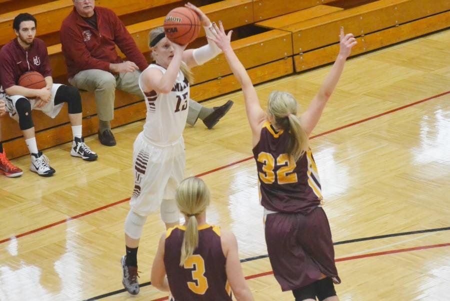 Senior Jordan Sammons on the three point shot attempt against the Concordia Cobbers on Dec. 6, 2014. Sammons finished the night with 24 points.
