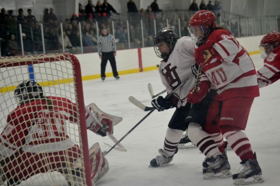 Senior+Jordan+Verleye+watches+the+puck+slip+by+the+St.+Marys+Cardinals+goalie+as+she+scores+the+go-ahead+goal+to+put+the+Pipers+up+3-2+late+in+the+third+period.+The+goal+was+Verleyes+final+home+goal+in+her+career+and+she+finished+the+night+with+a+goal+and+two+assists.