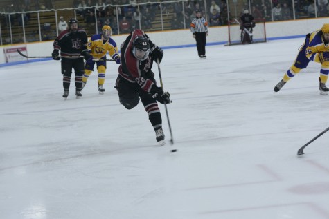 Junior Brandon Zurn breaks the puck out of the neutral zone.