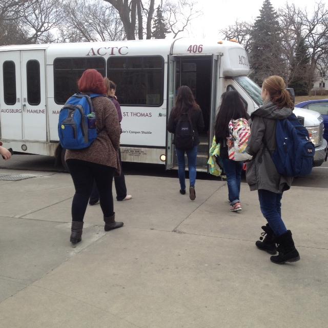 Students board the ACTC bus, which will be discontinued after May 22.