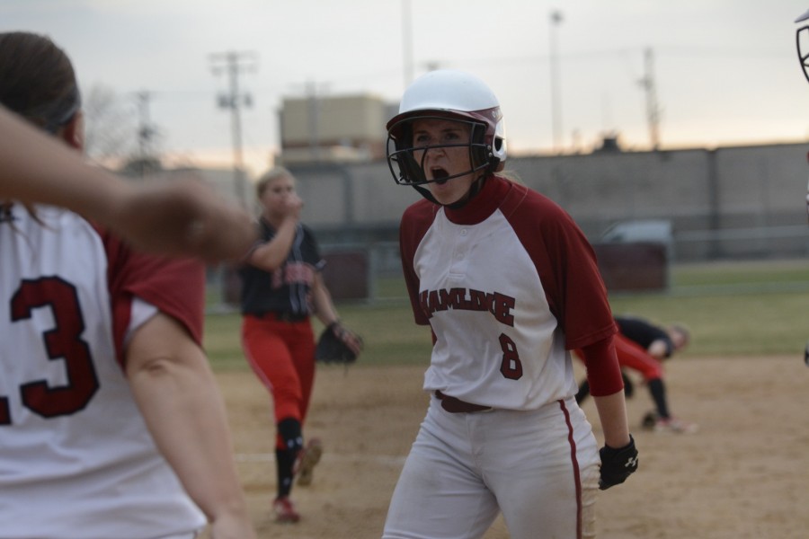 Junior Jamie Rubbelke celebrates after scoring a run for the Pipers.