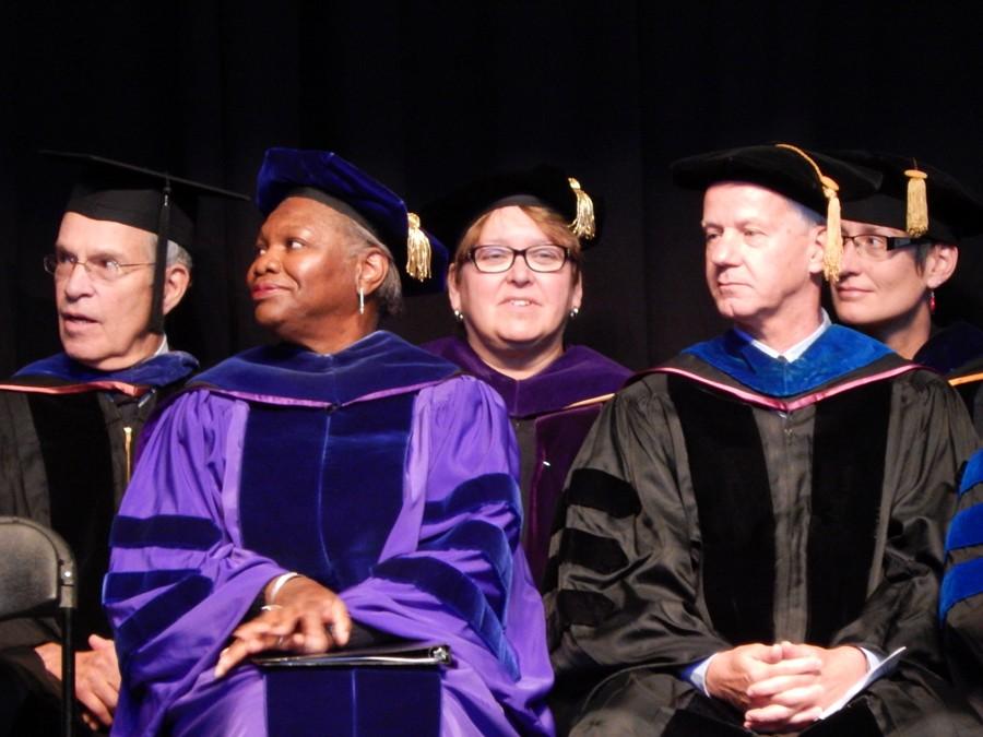 President Fayneese Miller and Dr. John Matachek, Interim Provost, listen to Professor Alice Moorhead give the faculty address at the 2015 Convocation and Matriculation ceremony.