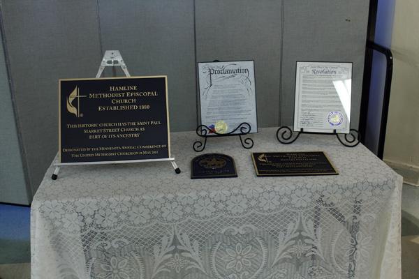 Plaques honoring Hamline Church along with documentation recognizing the building as a historical site. 