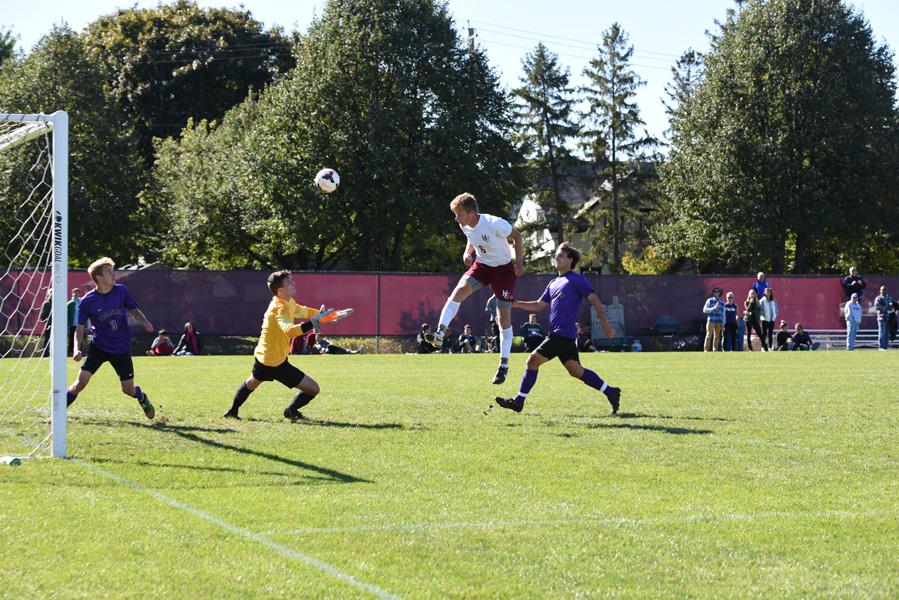 Trevor Tallaksen heads in the first goal against St. Thomas on Saturday, Oct. 3.