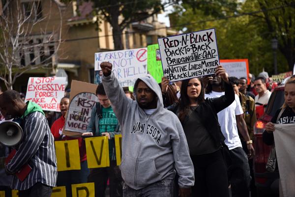 Black Lives Matter protesters march down Western Avenue toward the Twin Cities Marathon on Sunday Oct. 4 .