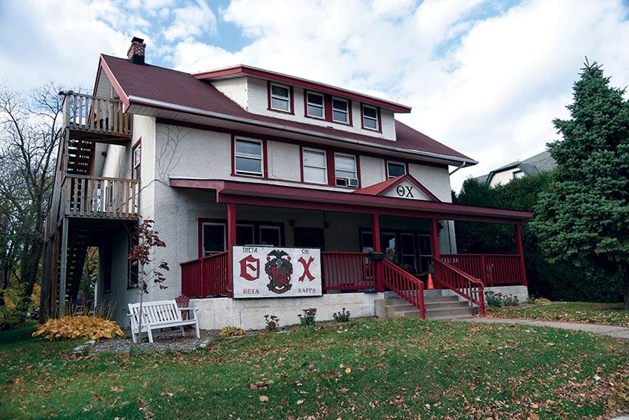 An unkown male was seen waiting on the porch of the Theta Chi house the same day electonics, money and other personal items were stolen from two members. 