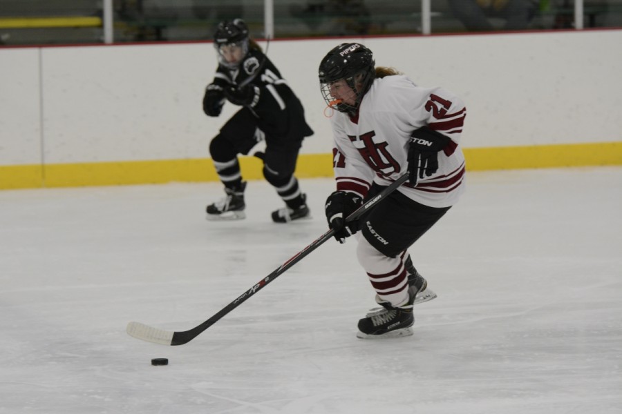 Now senior defenseman Jenny Magill moves the puck forward in the Pipers 1-4 loss against Bowdoin on Jan. 3.