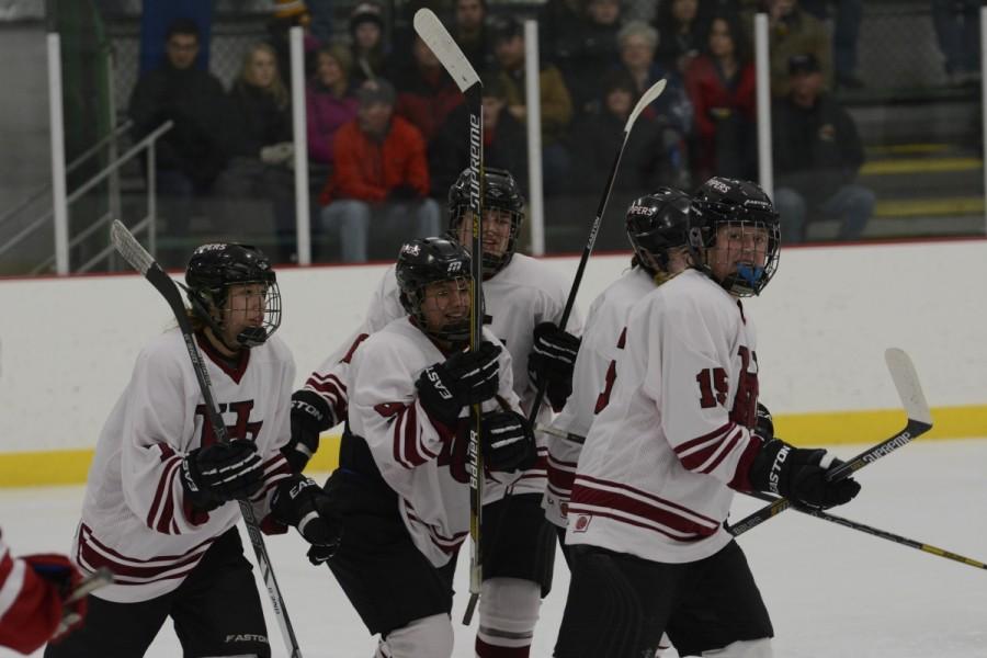 Pipers celebrate after scoring a goal last season at Oscar Johnson Arena on Feb. 6.