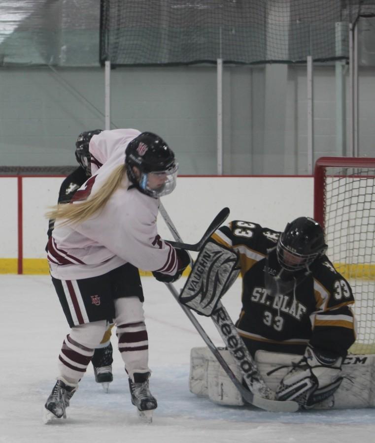 First-year forward Brede Postier slips the puck past the Oles goalie in Oscar Johnson Arena on Nov. 13. Postier scored two goals against St. Olaf, leading to a 4-4 overtime tie.