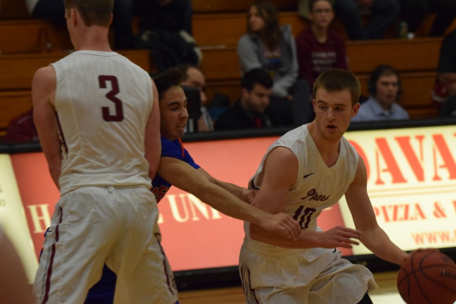 Sophomore guard Zach Smith working through a Macalester defender in Hutton Arena last Wednesday, Dec. 2. He scored 14 points and had seven assists.