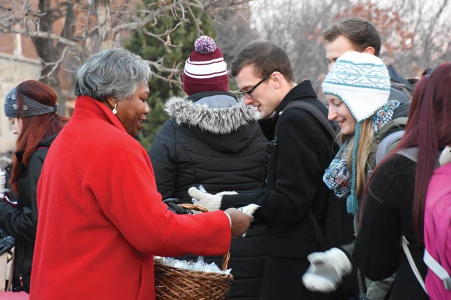 President Miller passes out cookies before the tree lighting cermony Thursday. 