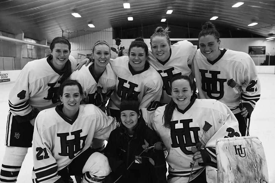 The womens’ hockey team’s seniors pose for a photo in honor of Senior Night at their game on Feb. 12.