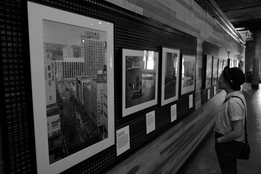Natalie Iverson (17), a Hamline student, takes in the photographs of downtown Minneapolis in the 1970s taken by Mike Evangelist at Mill City Museum.