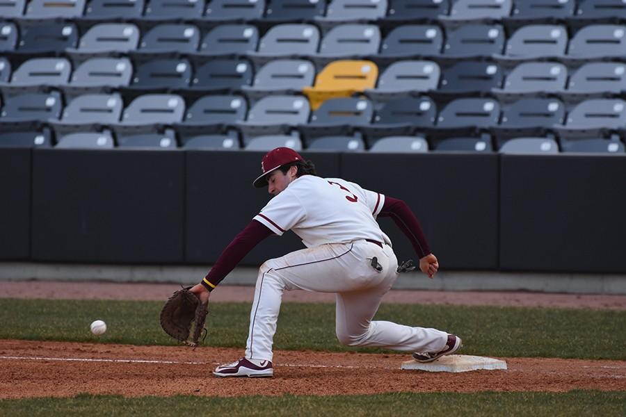 First baseman Jacob Picht picks a ball out of the dirt for an out at the home opener this past week at CHS field.