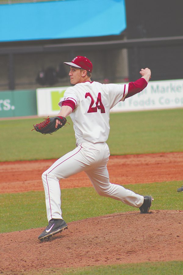 Pitcher and sophomore Brandon Rushmeyer winds up for a pitch during the April 20 game against Bethel.