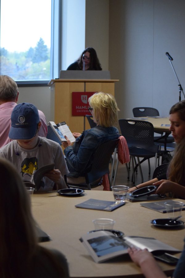 Poet Rebecca Drobinski reading to the crowd at the 2016 Fulcrum release party on Thursday, April  28 in Anderson Center. The Fulcrum is Hamline’s in-house undergraduate literary journal, compiled by student editors.