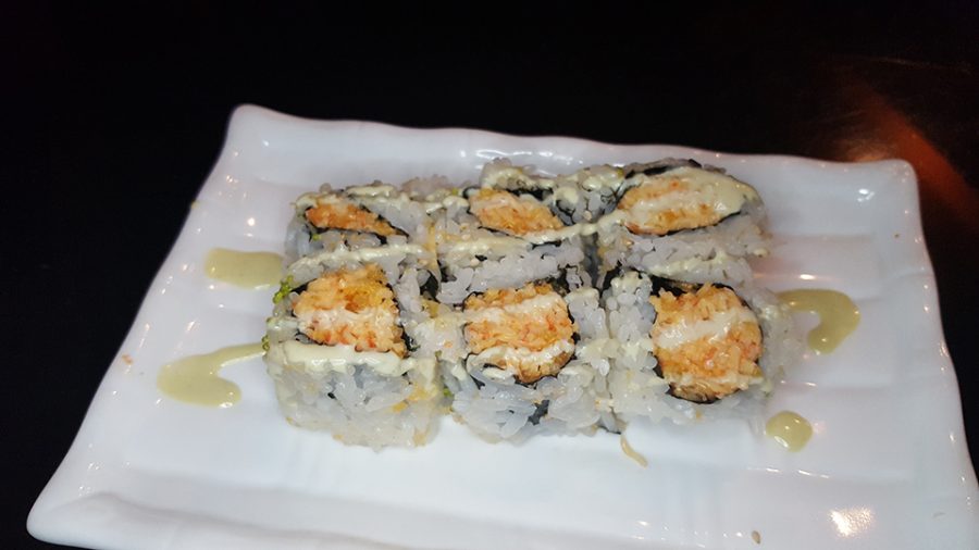 The Boston Roll, a Maki roll with spicy crunch crabmeat and topped with wasabi tobiko and sauce.