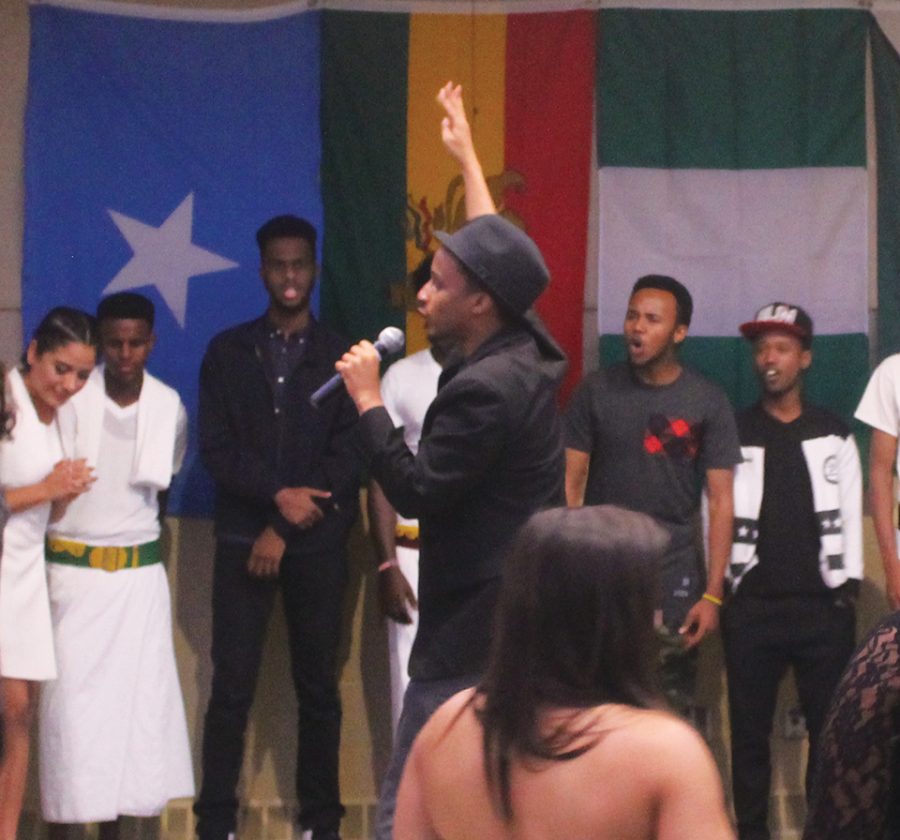 Rapper Malik Curtis performs in front of the crowd, focusing his lyrics on the struggles of black youth.