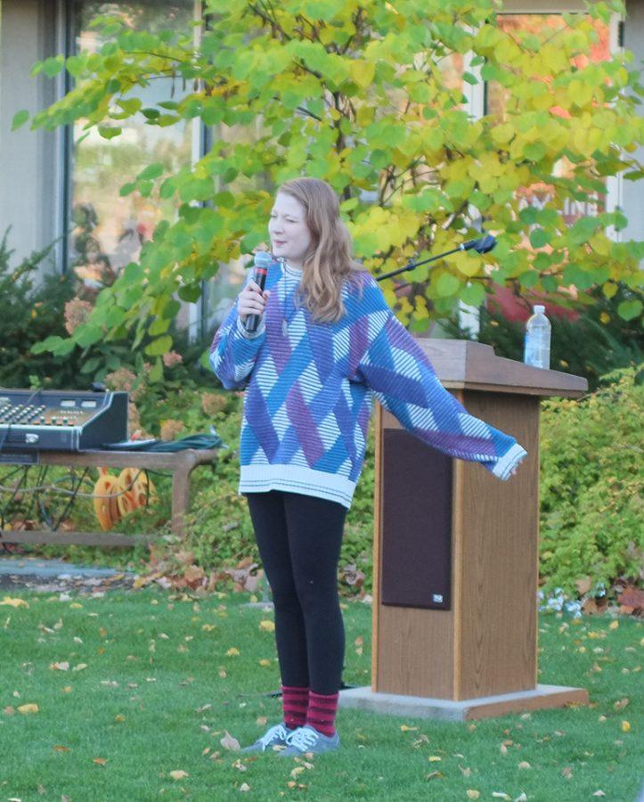 Junior Blythe Baird performs a slam poem at Take Back the Campus.