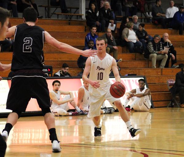 Junior guard Zach Smith (10) presses the attack against Augsburg in Hamline’s 60-69 defeat to the Auggies.
