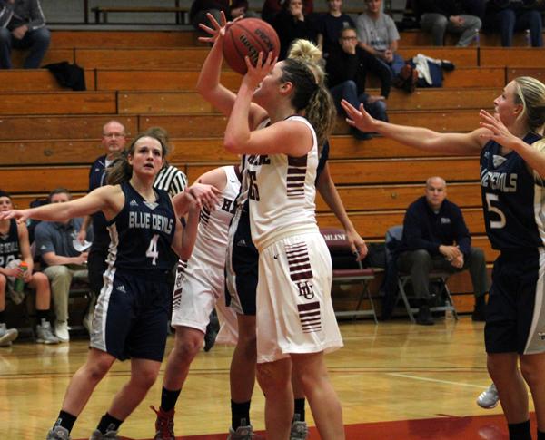First-year forward Aly Sartain (25) attempts one of her three shots in Hamline’s 63-70 home defeat to UW-Stout.