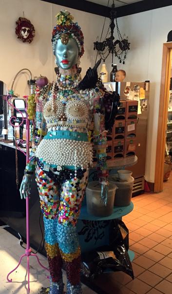 A mannequin decked out in beads and jewelry resided in the corner of the café.