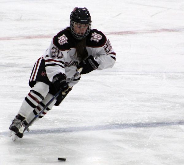First-year Bre Simon carries the puck into the offensive zone in Hamlines 2-3 OT defeat to UW-Eau Claire.