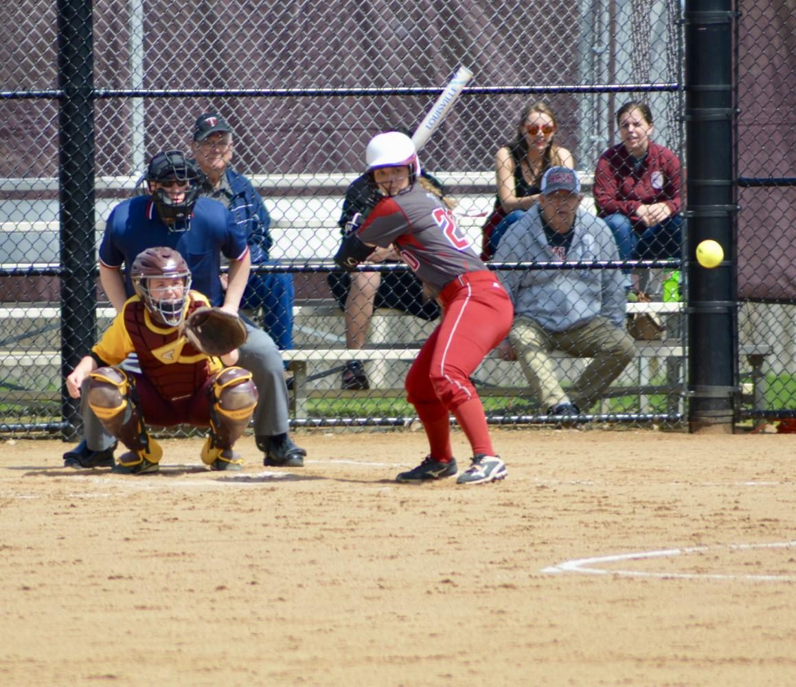 Junior catcher Abbie Annen watches a pitch come in against Concordia.