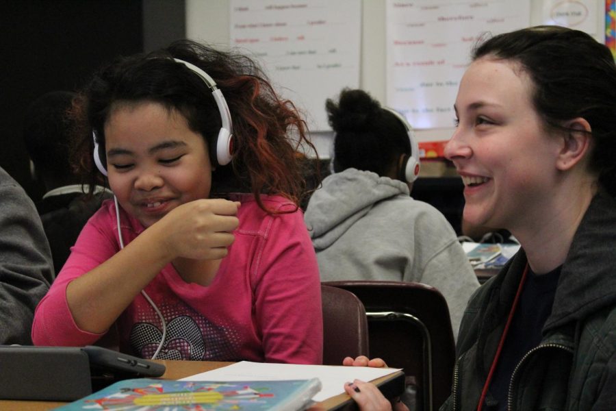 Tutor Alexis White and student Savatia Vang share a laugh during class. 
