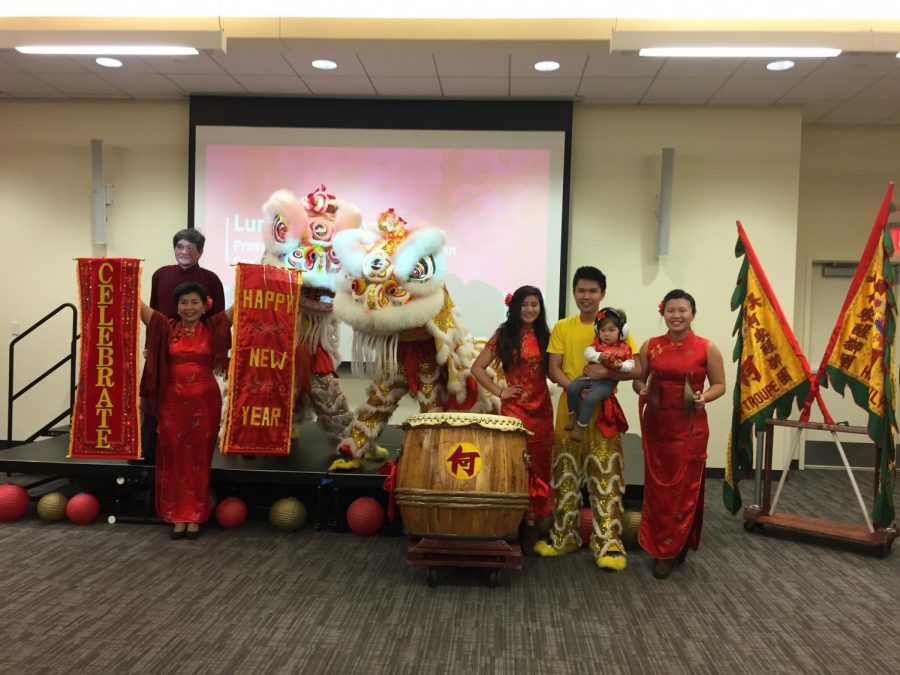 Members of the Ha Family Lion Dance Troupe pose after performing a traditional Chinese lion dance.