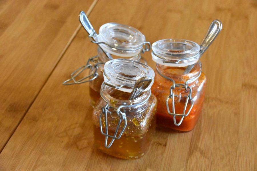 Glass jars of sauces sit atop every table. 