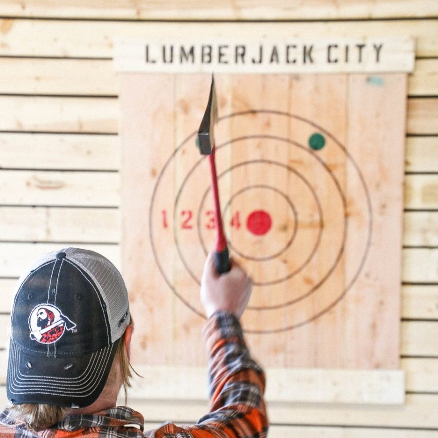 A person throws an axe at Lumberjack City