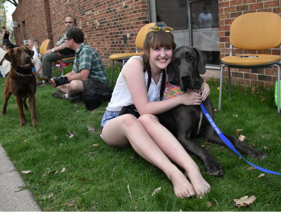 First-year Sophie Donahue poses with Phoenix, a Great Dane therapy dog traveling with his handler Alison from North Star Therapy Animals. 