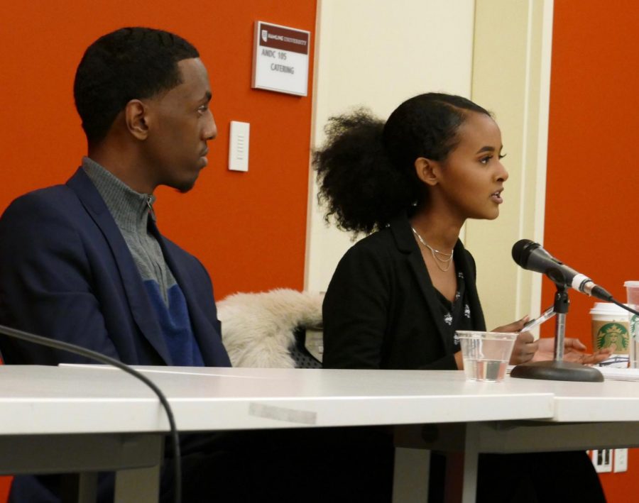HUSC presidential candidate sophomore Maryan Hersi answers questions as vice presidential candidate sophomore Abdi Badri looks on.