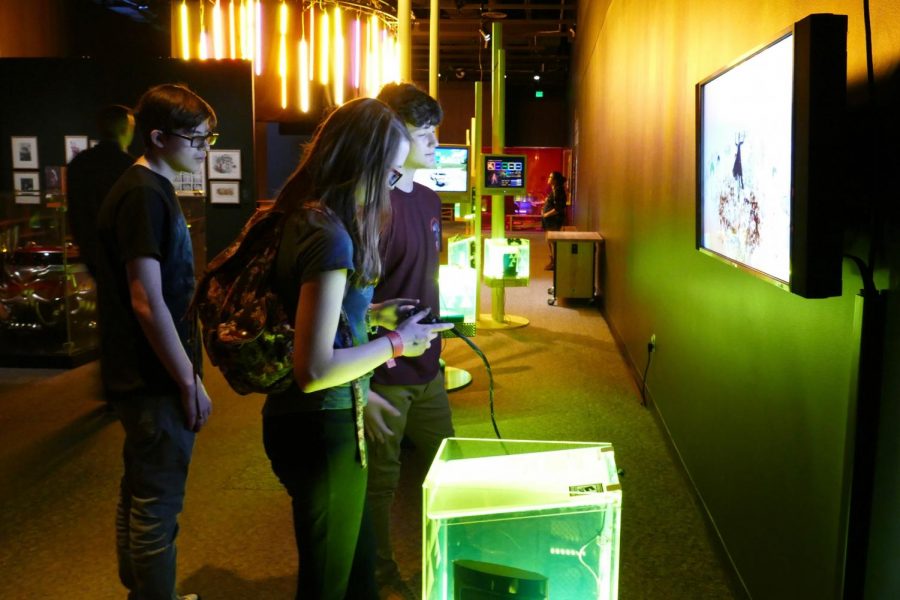Museum attendees play shooter game Child of Eden, developed by Q Entertainment.