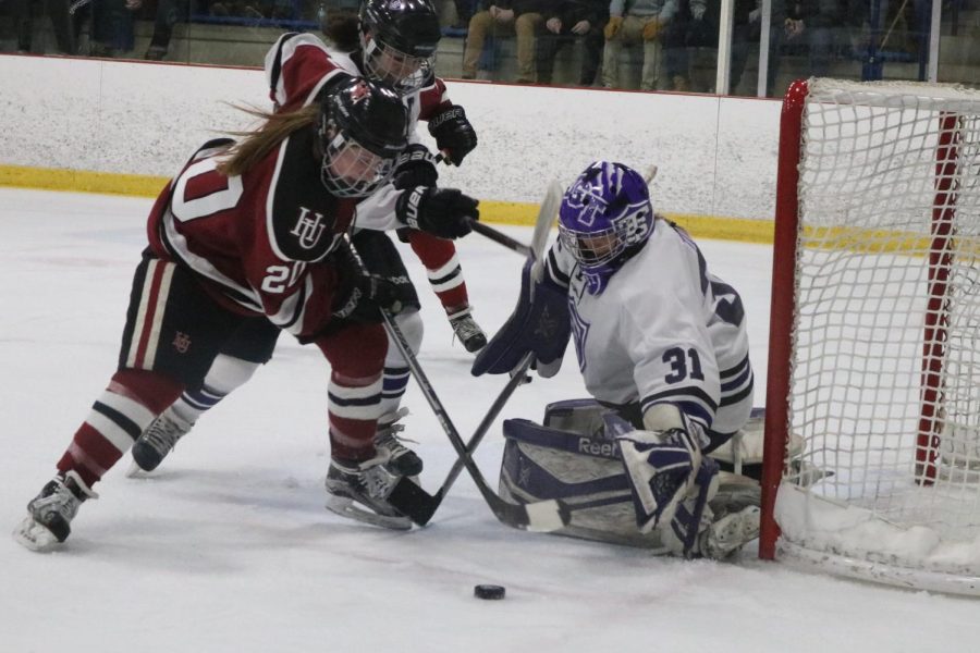 An opportunity arises for junior Bre Simon as she tries to find an opening between the Tommies’ goalie and the net.