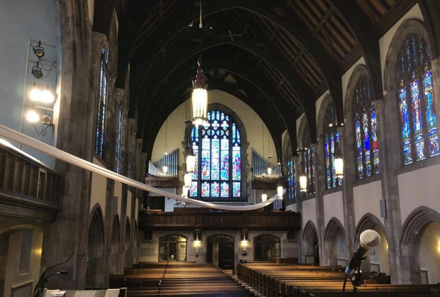 Hamline Church’s interior boasts Gothic design, with stained-glass windows and wood-covered steel beams.