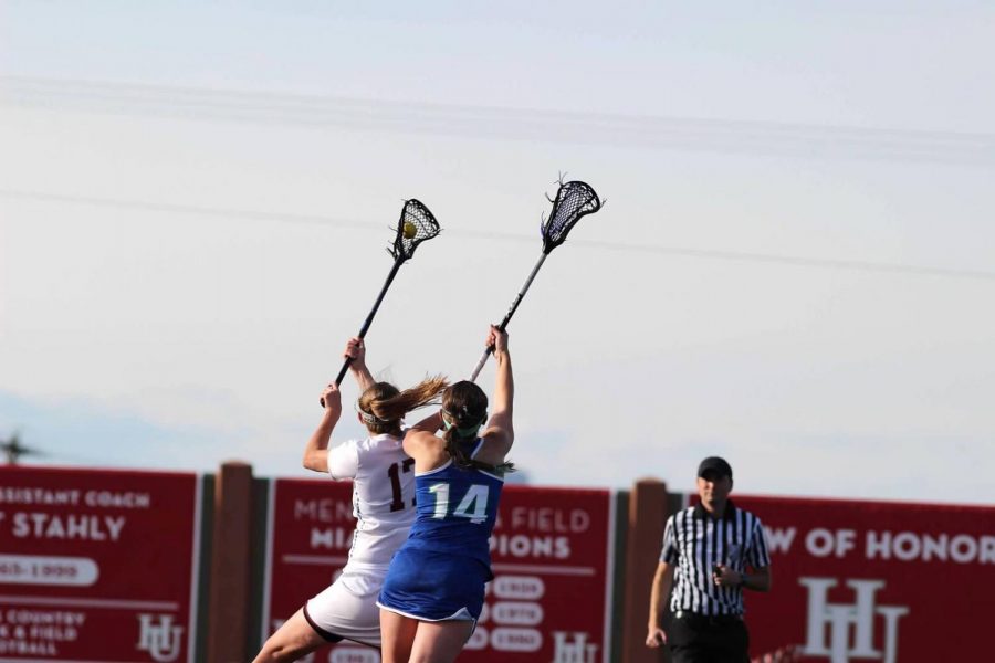 Junior Brayden Maass gets the ball during the Midwest Womens Lacrosse Championship game against Aurora on May 4, 2019.