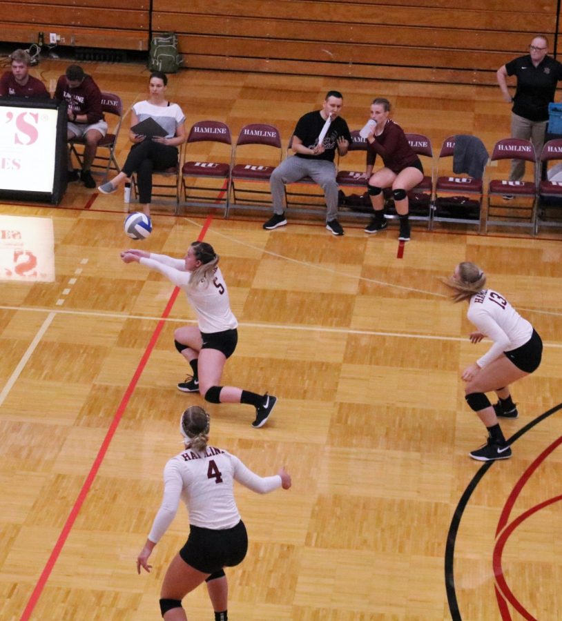 Senior Morgen Coleman (#5) reacts to serve from opposing team.