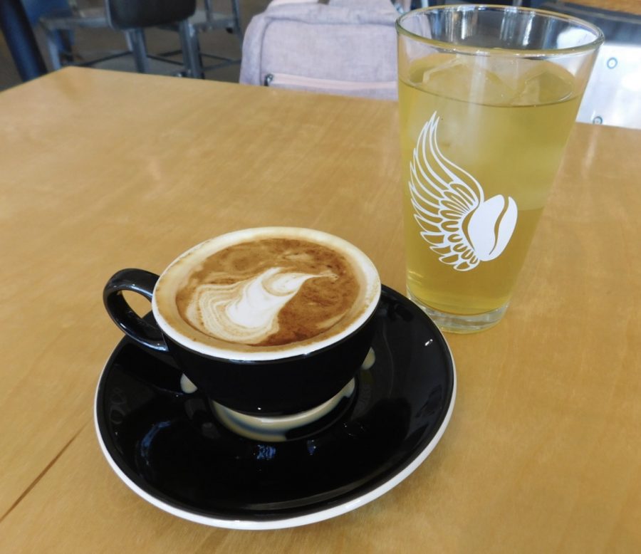 This Mango Green Iced Tea served in a small glass and this cappuccino, made of micro-foamed steamed milk and espresso are two items on BlackStacks menu.