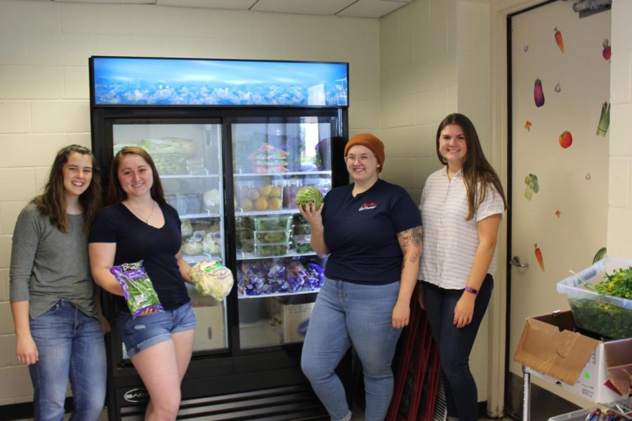 Volunteers Maggie Burns, Mary Anthony, Alexa Clausen, and Emma Kiley ready to help people coming to the pantry.