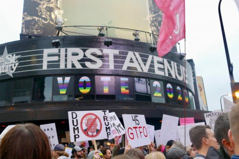 Nightclub First Avenue, which stands across from the Target Center, promotes an inclusive voting message to the crowds below, with signs stating VOTE 2020 spelled out in rainbow letters and numbers.