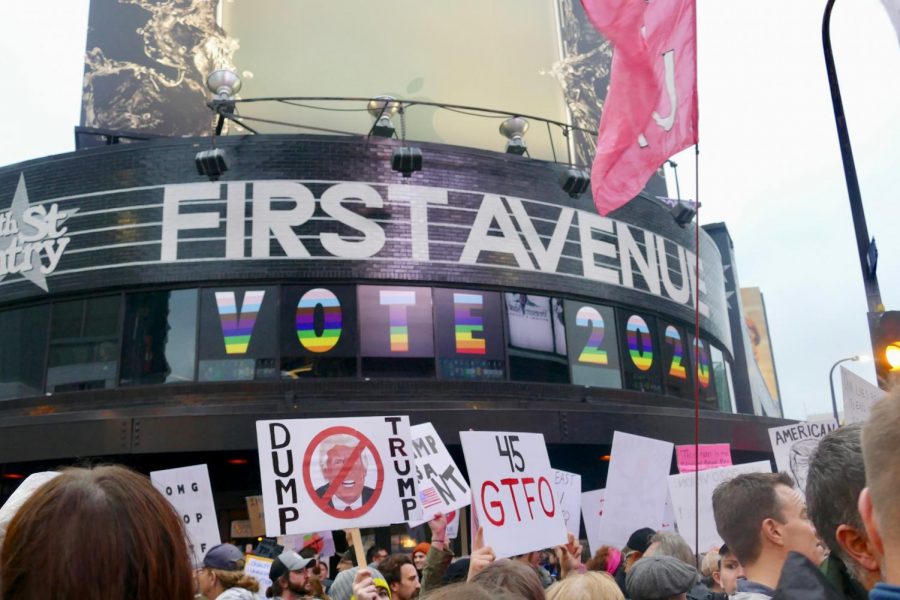 Nightclub First Avenue, which stands across from the Target Center, promotes an inclusive voting message to the crowds below, with signs stating VOTE 2020 spelled out in rainbow letters and numbers.