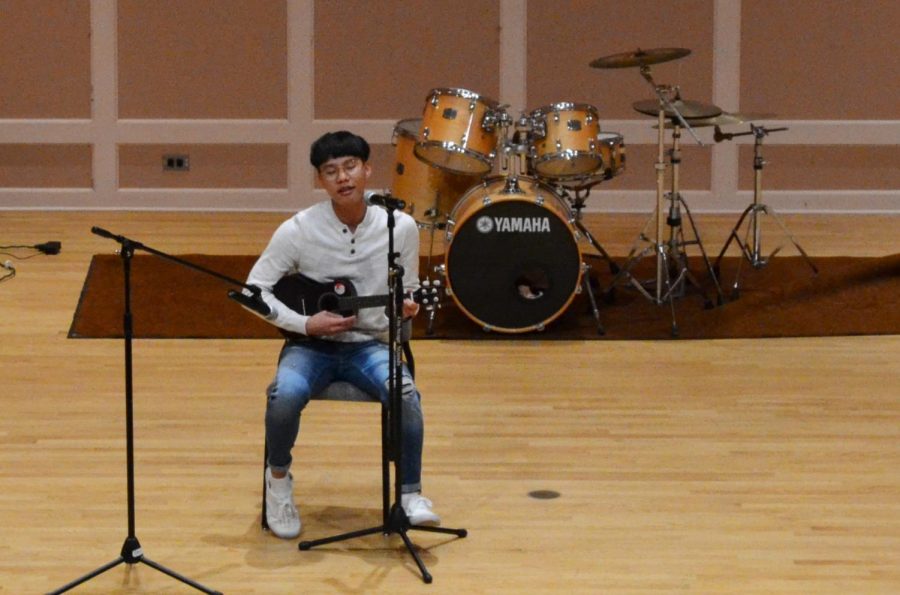 Junior and Chair of Hmong Student Association External Public Relations Toumeng Yang shows his musical talent.