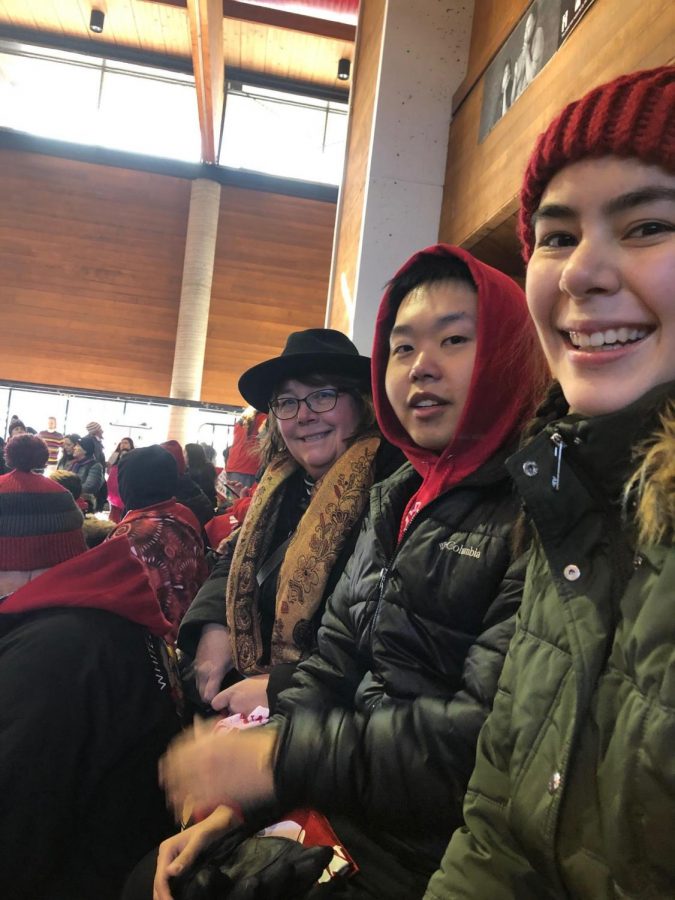 From left, Chaplain Nancy Victorin-Vangerud, senior Plykue Thao and first-year Emily Mckenzie attend the opening blessing and welcome song at the Minneapolis American Indian Center before marching to honor the indigenous women and people who have been victims of violence. 