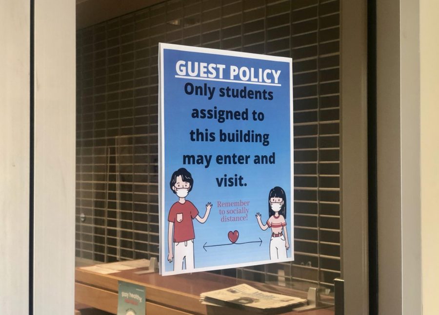 A sign posted reminding students that guests are not allowed into the building